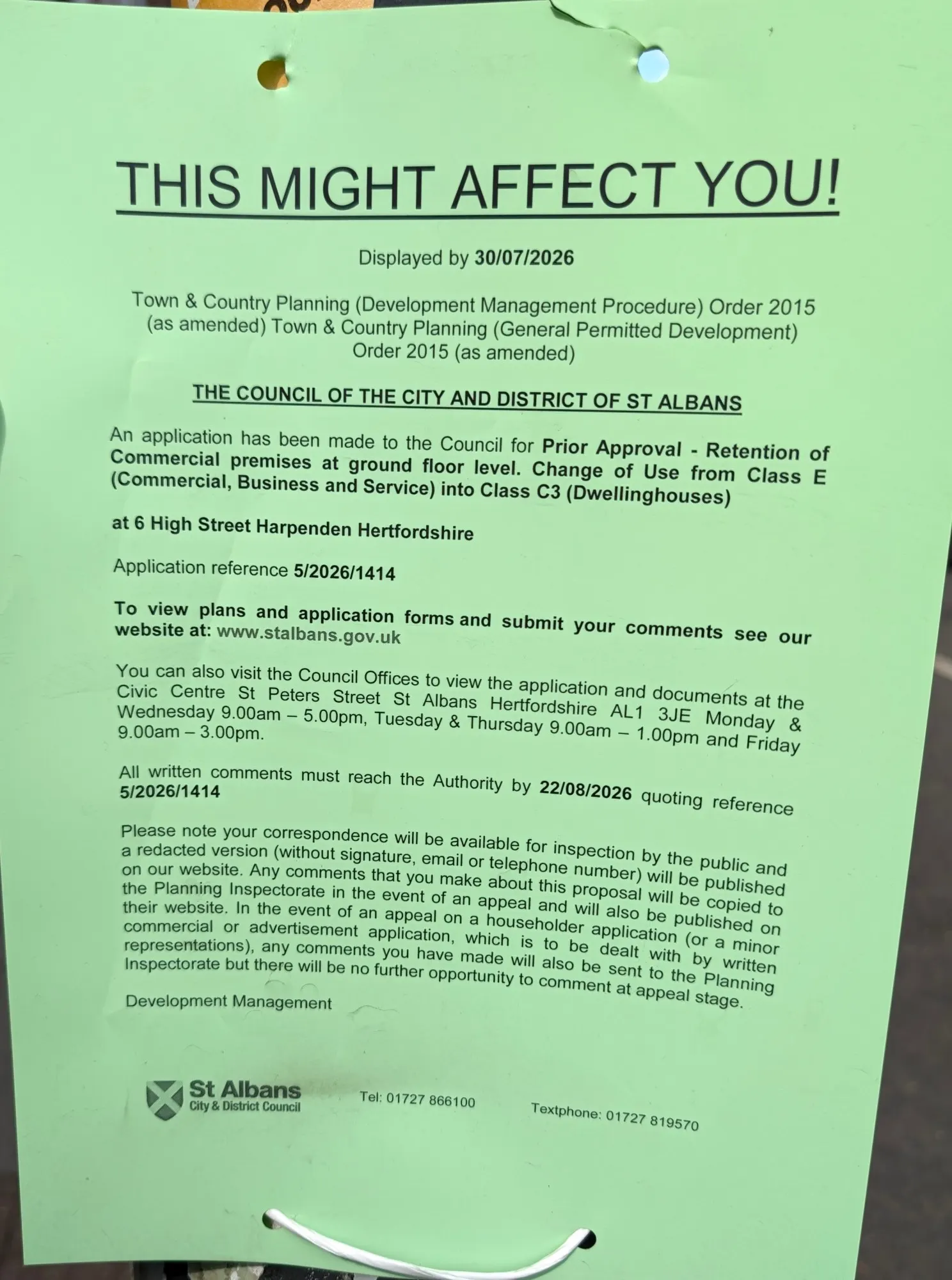 A green council planning notice headed "This might affect you!" for application 5/2026/1414 at 6 High Street, for prior approval to turn the upper floors into homes while keeping the ground floor commercial